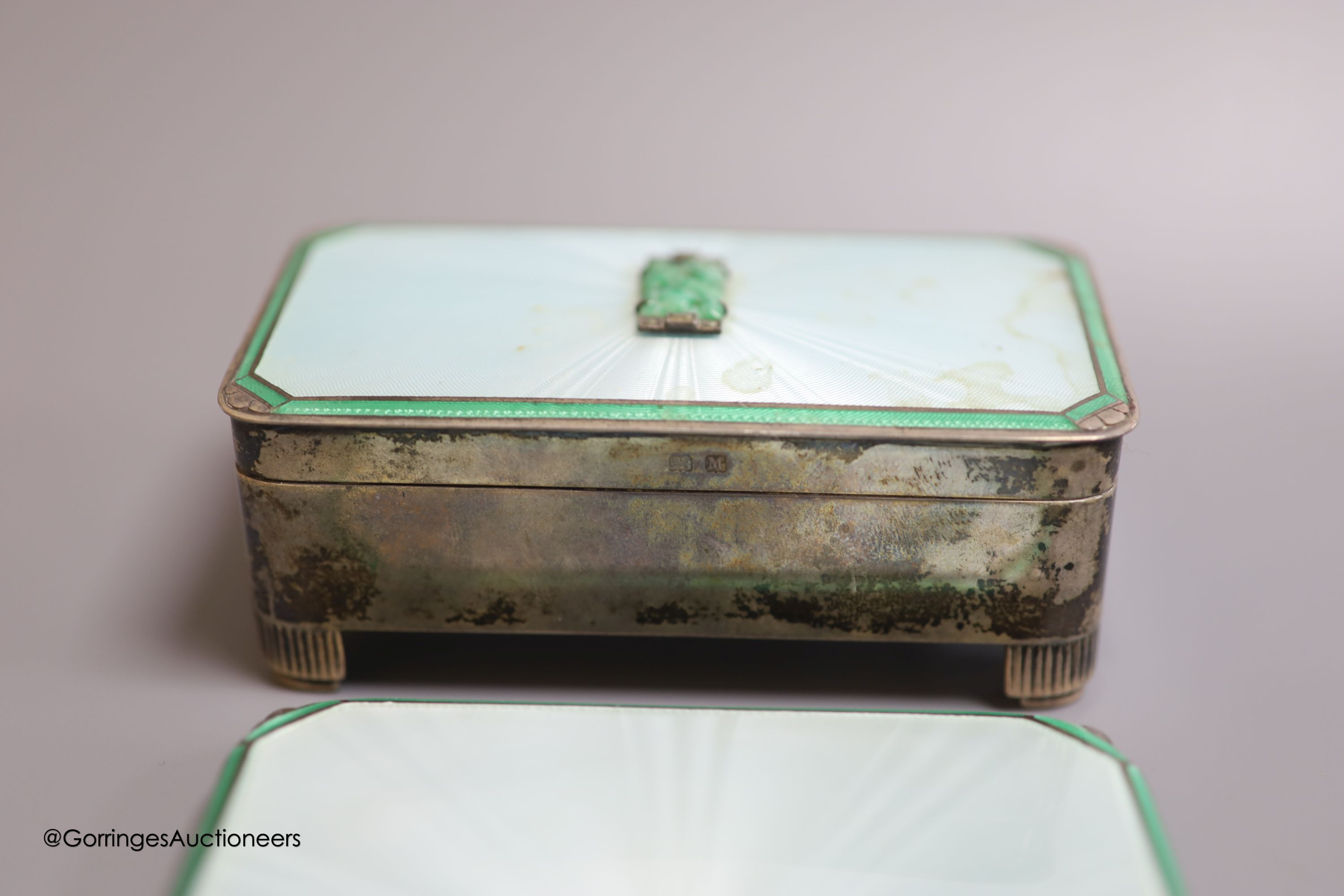 A 1930's Art Deco six-piece silver, enamel, marcasite and jade set dressing set, including a rectangular trinket box(a.f.) 10.5cm, Adie Brothers, Birmingham, 1936.